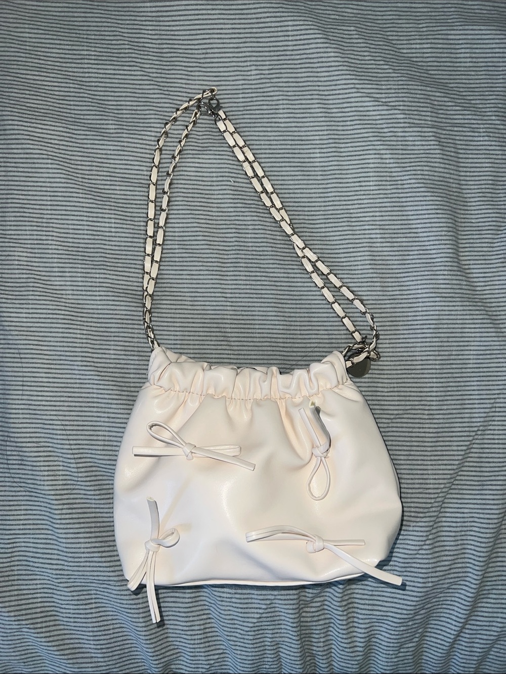 Women's Cream Drawstring Shoulder Bag with Bow Accents
